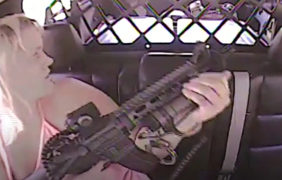 Clay, from Oklahoma, managed to get her hands free and grab the cop's assault rifle