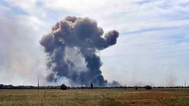 Smoke rising after a series of explosions at the Saki airfield