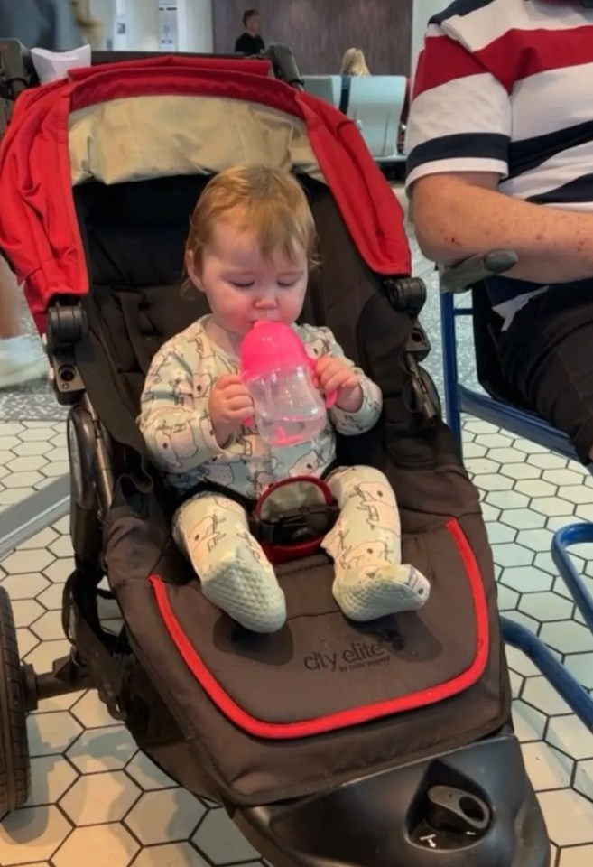 Nine-month-old Eliza in the pushchair at Bristol Airport before the mix-up