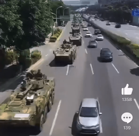 Columns of tanks moving through Xiamen in footage shared on Weibo