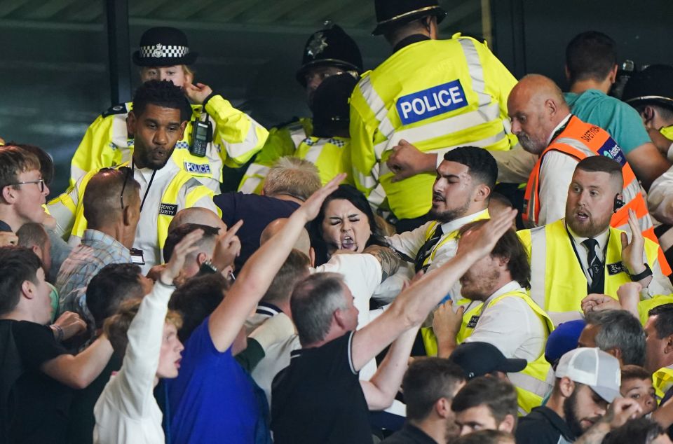 Police and stewards struggled to calm tempers in the Carrow Road stands