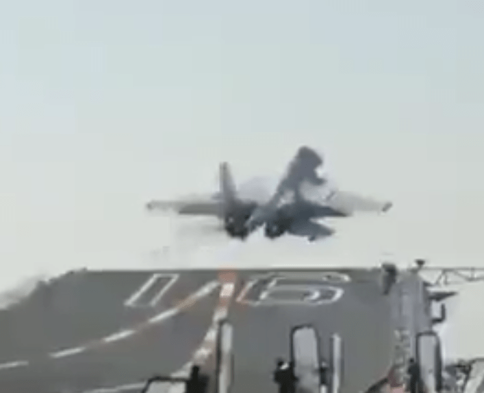 The carrier is seen launching a warplane amid the tensions