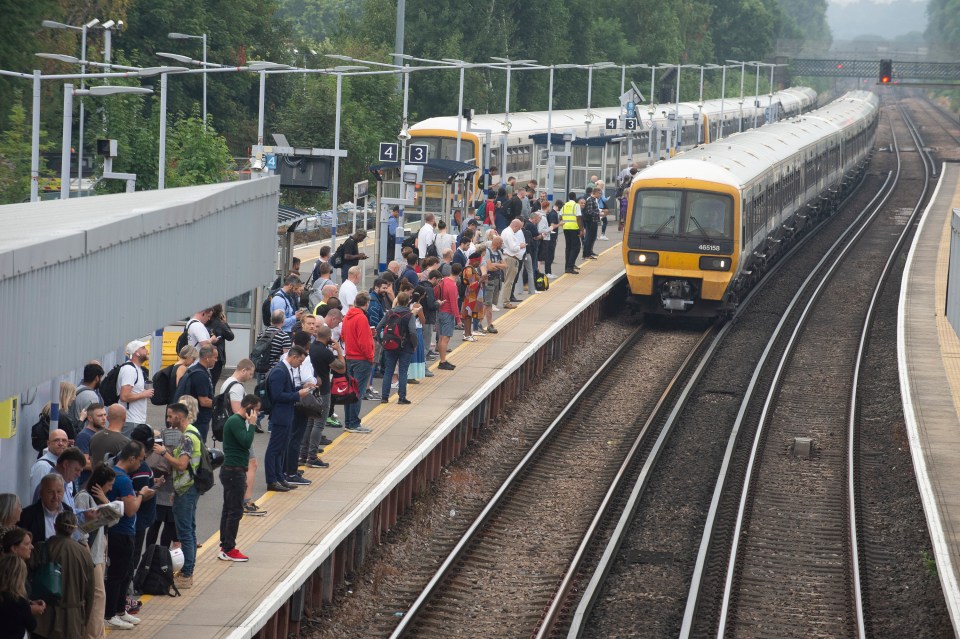 London commuters queued for a train at Petts Wood in South East London this morning