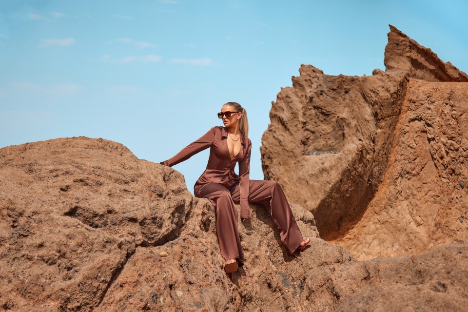 Molly posed on a cliff as she modelled a sleek chocolate brown co-ord