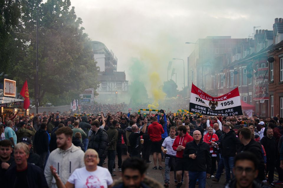 Protests fill the street heading up to Old Trafford