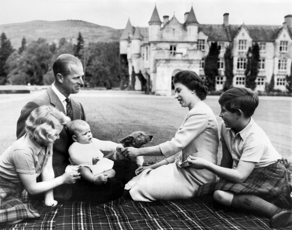 The Queen and Prince Philip with their children Charles, Anne and baby Andrew in the grounds of Balmoral in 1960