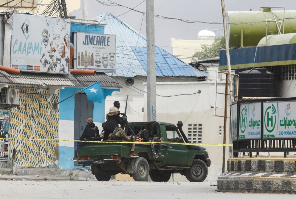 Somali security officers are seen at a section of the hotel