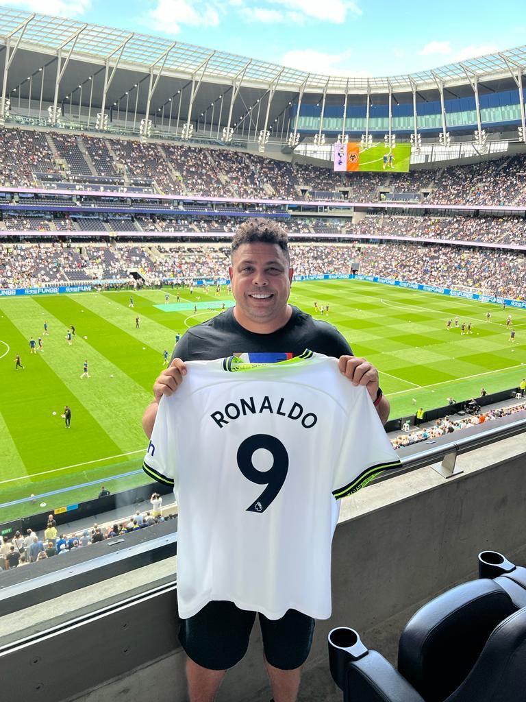 Ronaldo poses with a Tottenham shirt during their clash against Wolves