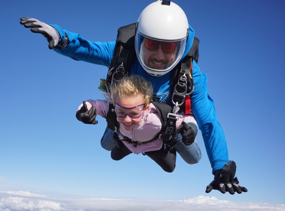 Lola-Jo smiles as she jumps from 12,000ft