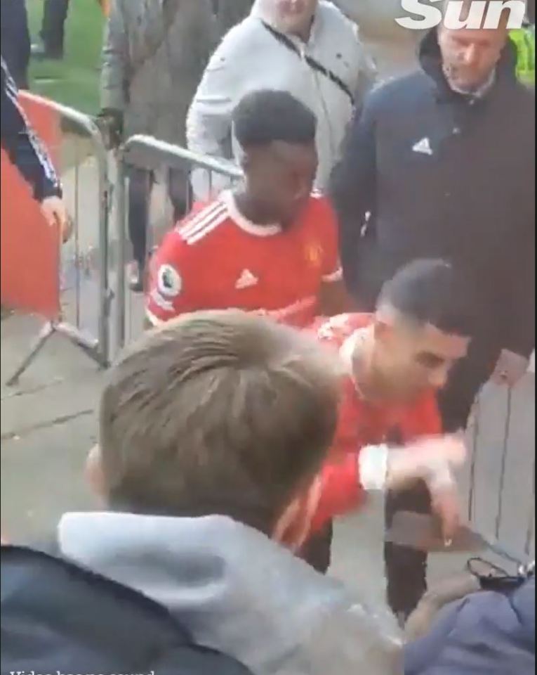 The Man U forward was caught on camera slapping the phone from the boy's hand