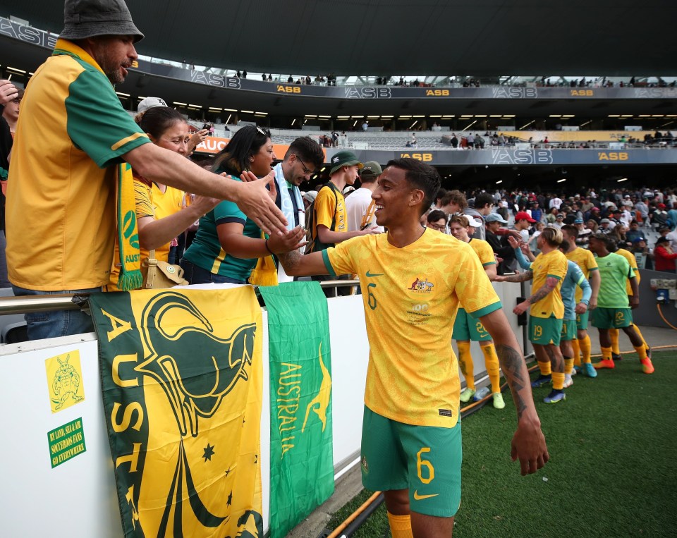 Australia always stand out in their yellow shirt with green shorts