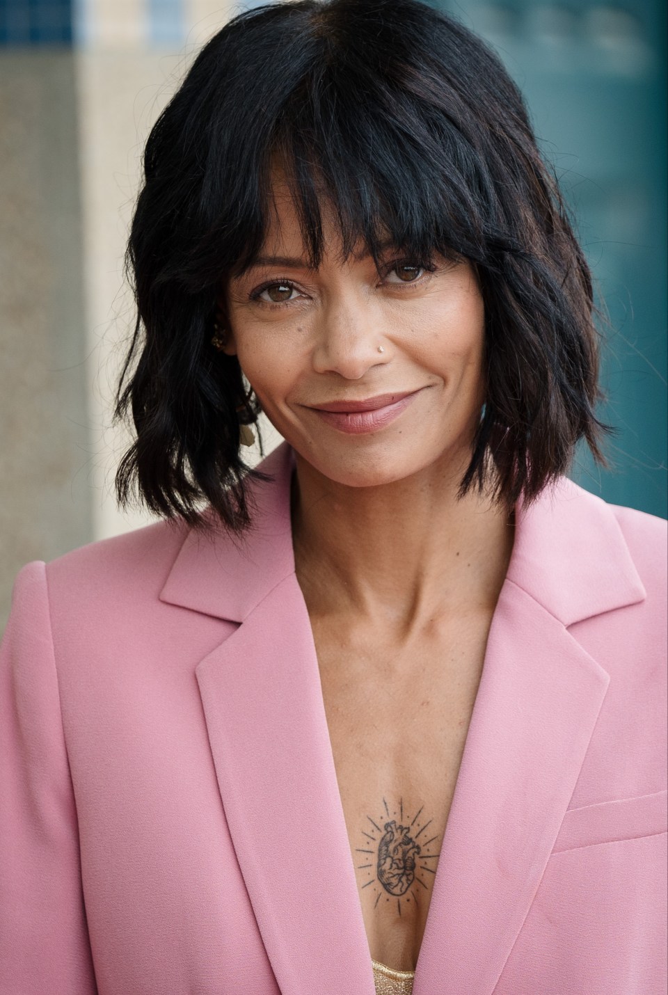 She wore a plunging pink suit with a bob haircut at the Deauville American Film Festival in France