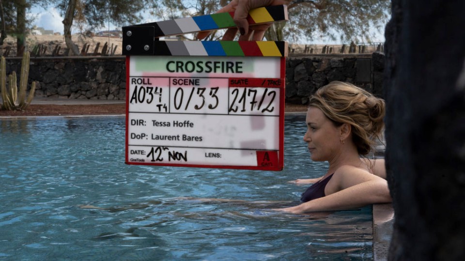 The actress in a pool scene in the opening episode of Crossfire