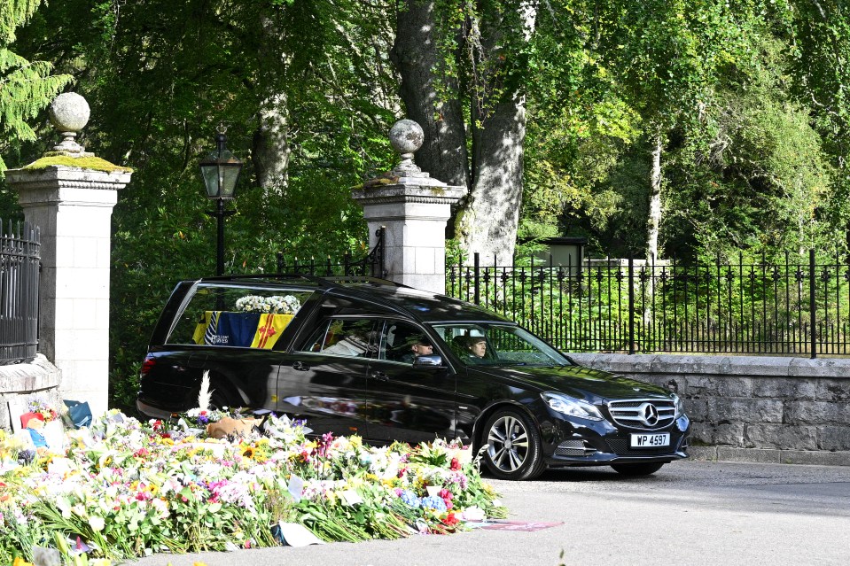 The Queen's coffin is covered in the Royal Standard of Scotland while it is north of the border