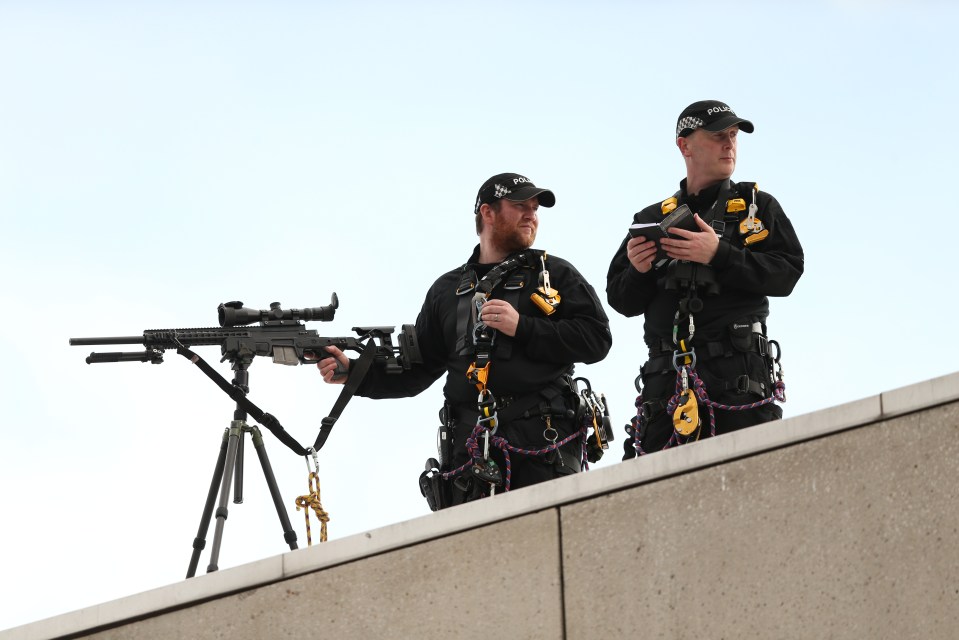 A ring of steel of police snipers is surrounding the Queen's coffin