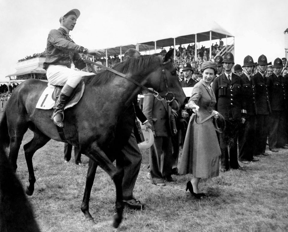 Queen Elizabeth II leading in her Oaks winner, Carrozza, with Lester Piggott in the saddle