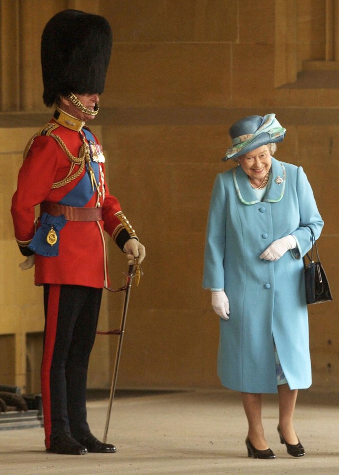 The monarch was seen laughing at her husband's military regalia