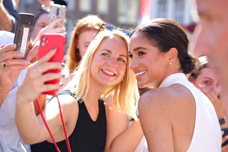 Meghan Markle beamed in selfies on the red carpet yesterday