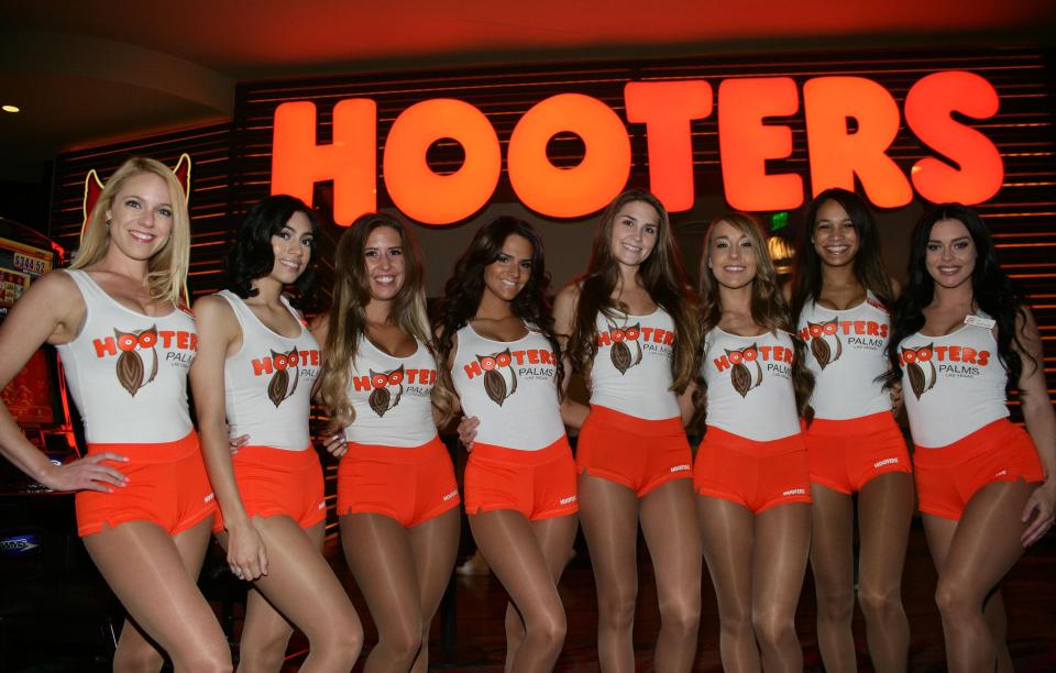 Hooters — a US bar and restaurant chain — is renowned for its attractive waitresses, who wear vest tops and orange shorts.