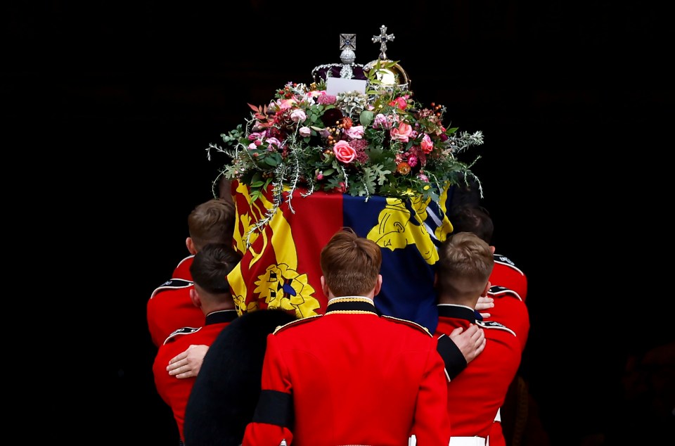 The Queen's coffin is carried into St. George's Chapel ahead of behind laid to rest alongside her husband Philip, Duke of Edinburgh