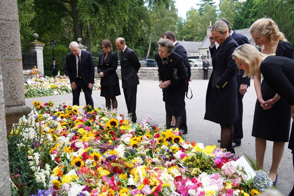 The Royal Family view floral tributes left for the Queen after her death