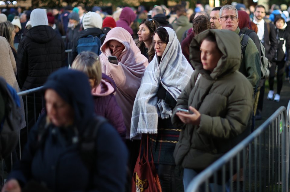 Mourners wrap up warm as temperatures plunged overnight