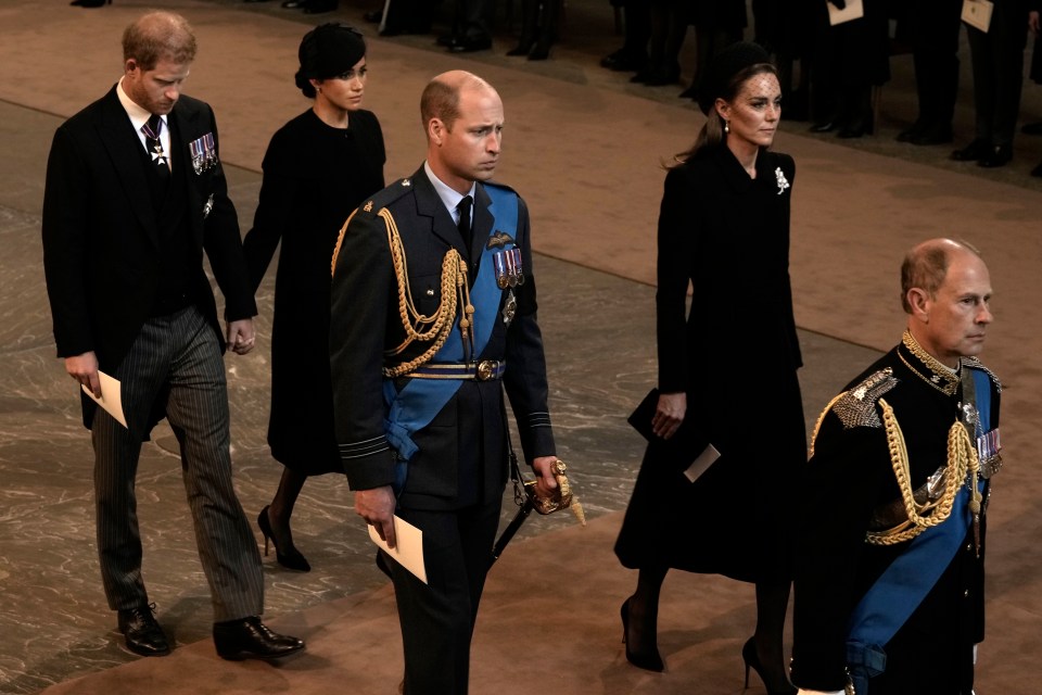 Heads bowed, The Sussexes appeared grief stricken as the emotional procession drew to a close