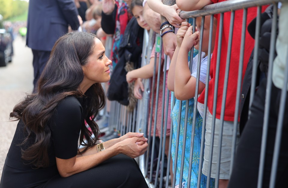 Meghan Markle kneels to talk to kids in Windsor on Sunday