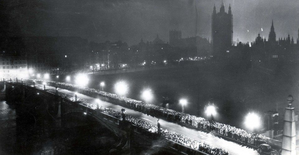 The line of people waiting to pay tribute to King George VI's lying-in-state at Westminster Hall extended over Lambeth Bridge in February 1952