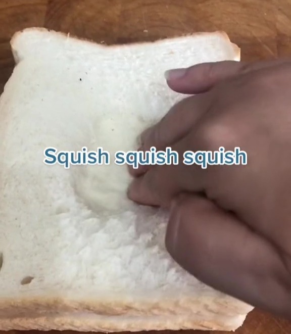 Squishing the bread will stop the egg from making a mess