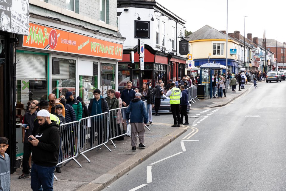 Around 400 hundred people are queuing to get fish and chops for 45p at the opening of Sheffield's Mother Hubbard's chippy