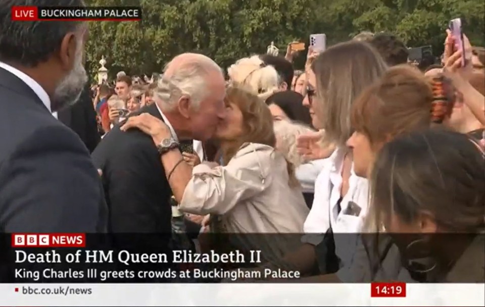 One well-wisher kissed the King on the cheek as he greeted Brits outside Buckingham Palace