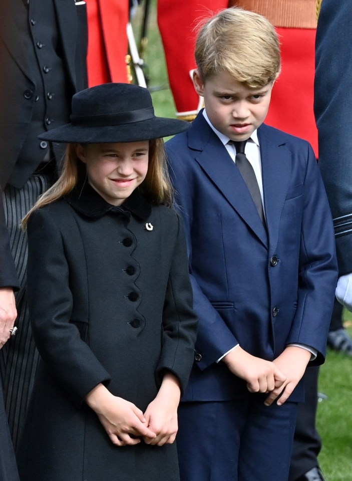 Princess Charlotte appeared to be reminding her brother Prince George about royal protocol at Queen Elizabeth II's funeral on Monday