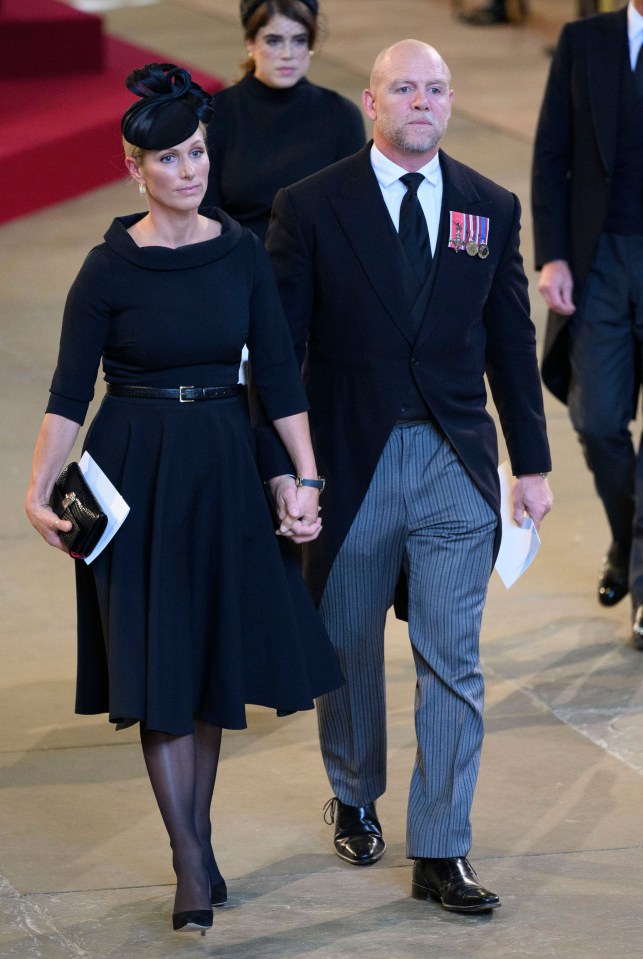 The pair looked solemn as they took part in the royal procession