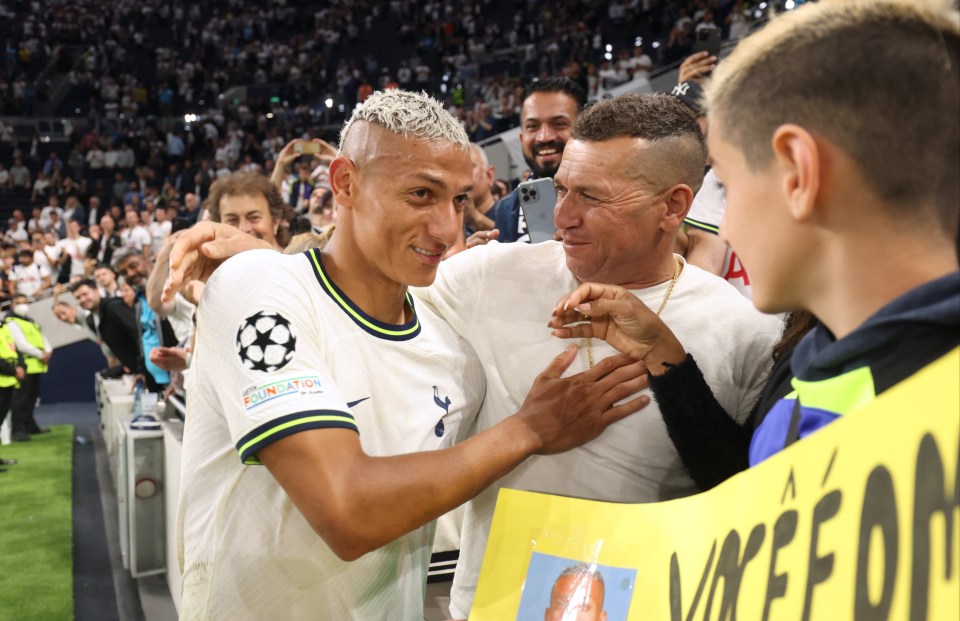 Richarlison is congratulated by his father at the final whistle