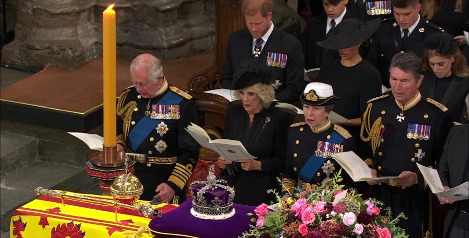 The King, Queen Consort, Princess Anne and her husband as a hymn is sung