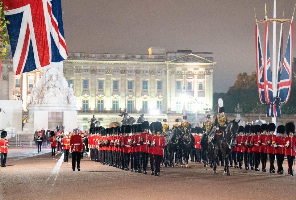 The troops outside Buckingham Palace where the procession will start the journey to Westminster Hall