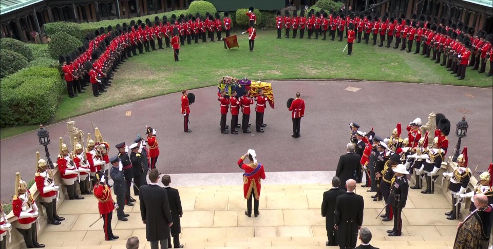 The Queen's coffin arrives at St George's Chapel in front of the Royal Family