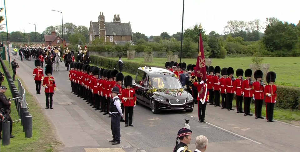 The State Hearse carrying the Queen's coffin makes its way towards Windsor Castle