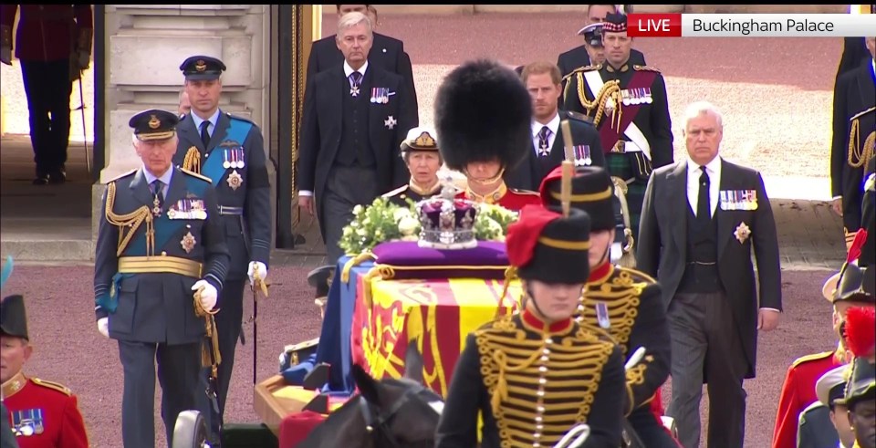 The Queen's coffin is being towed by the King's Guard, with members of the royal family walking behind