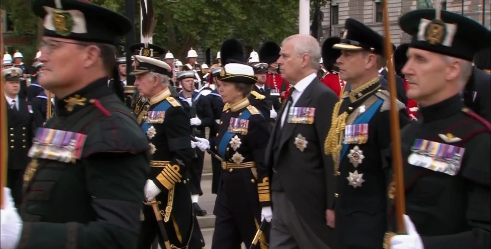 The Queen's children follow their mother's casket in a solemn procession