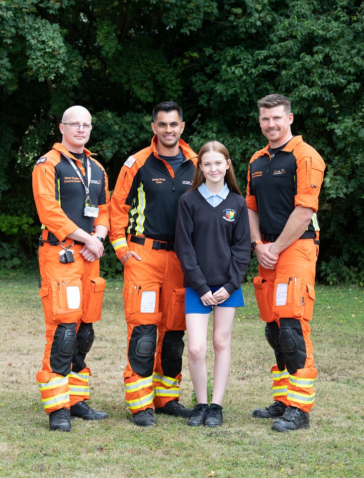 Daisy pictured with left to right Steve Chambers, James Price and Thomas Giddings from Magpas Air Ambulance