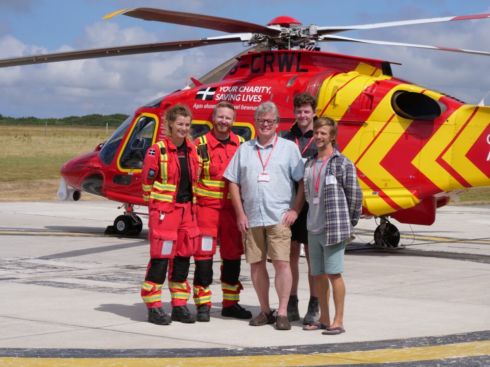 RNLI lifeguards Tom McRitchie and Graham Fisher and Cornwall Air Ambulance medics have been nominated in The Sun’s 999 Hero category for saving delivery driver Chris Barendt (centre)