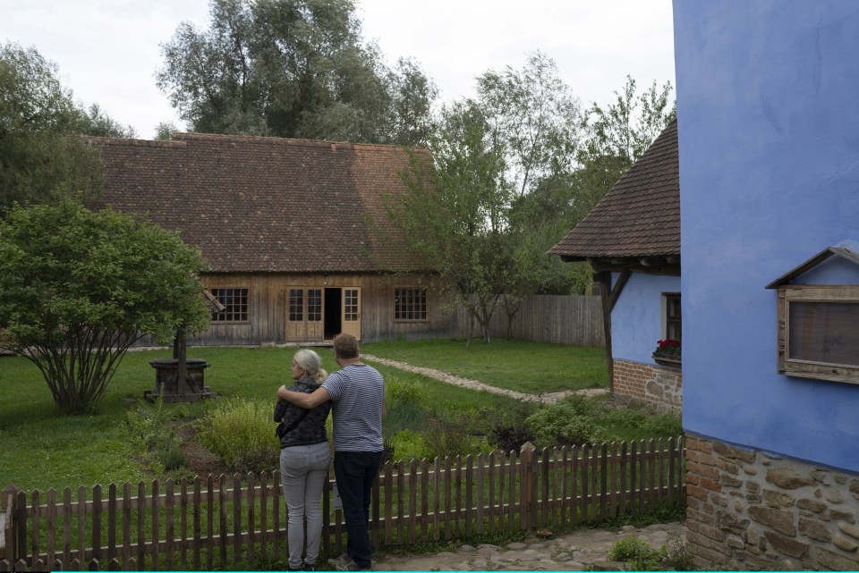 Tourists look at Charles’s home in the village of Viscri, which is a world heritage site