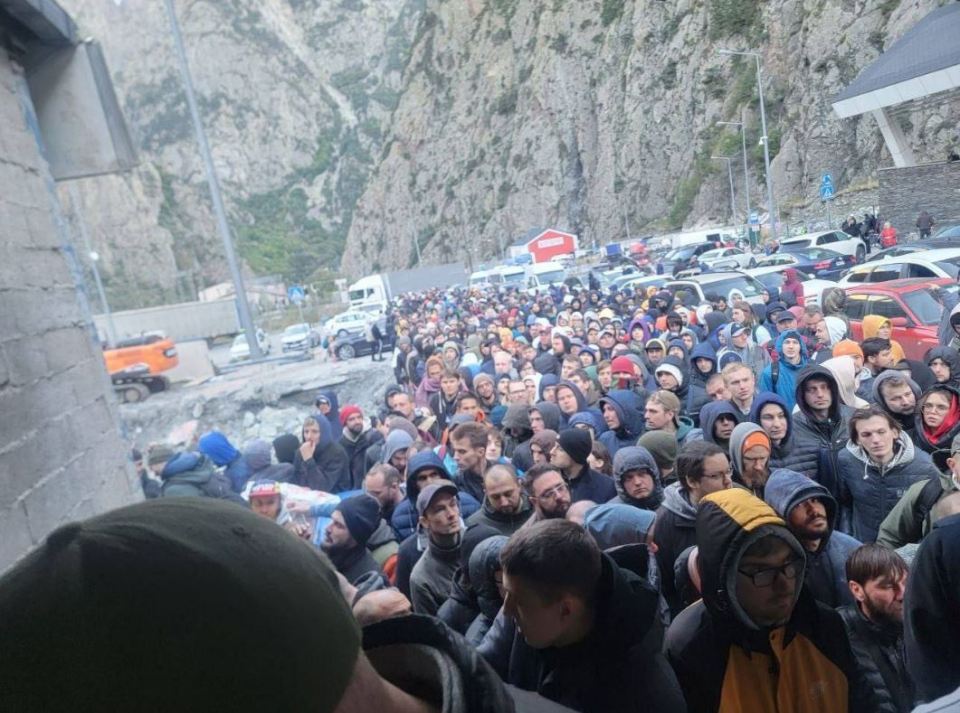 Meanwhile, men were seen queuing at the Georgian border as they flee their homeland