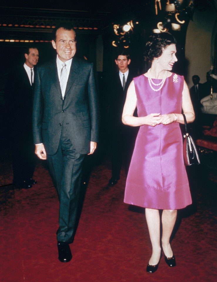 SIMPLE CHIC  . . . in a plain pink dress to meet US President Richard Nixon with Prince Charles in 1969