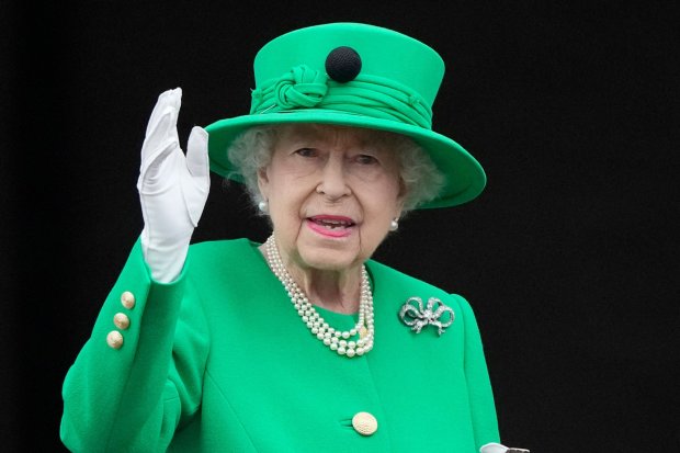 Queen Elizabeth II waves to the crowd from Buckingham Palace balcony at the end of the Platinum Pageant in London as part of Queen Elizabeth II's platinum jubilee celebrations