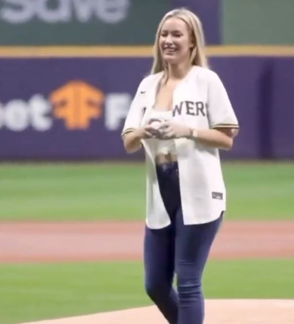 Paige grinned as she delivered the first pitch