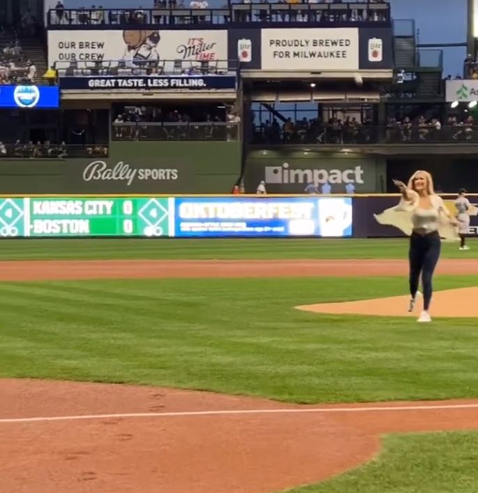 Spiranac loops over her first pitch