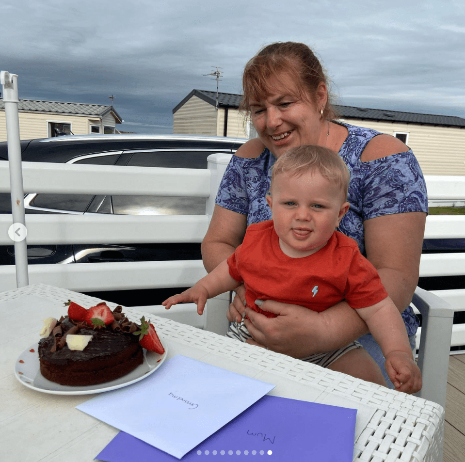 Julie enjoys a slice of birthday cake with her adorable grandson